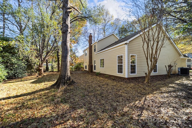 view of property exterior with central AC unit