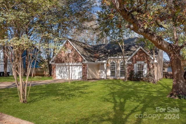 view of front facade featuring a front yard and a garage