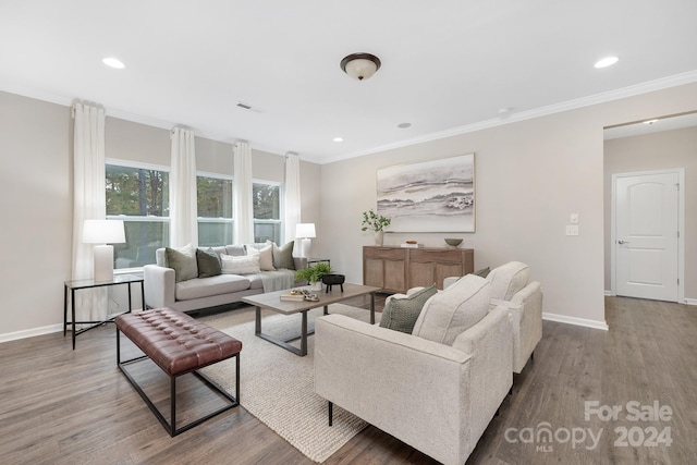 living room with hardwood / wood-style flooring and crown molding