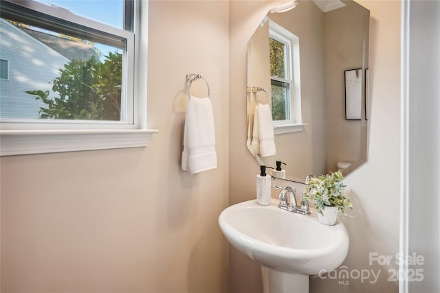 half bathroom with a sink