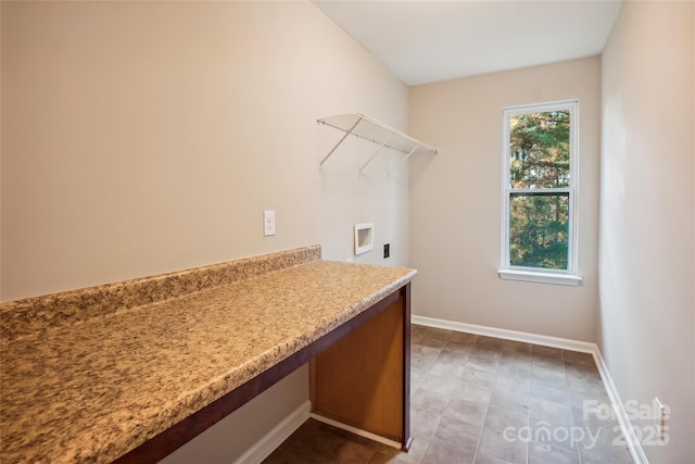 washroom featuring laundry area, a healthy amount of sunlight, baseboards, and hookup for a washing machine