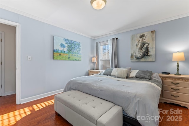 bedroom featuring dark wood-type flooring and ornamental molding