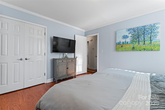 bedroom featuring hardwood / wood-style floors, a closet, and ornamental molding