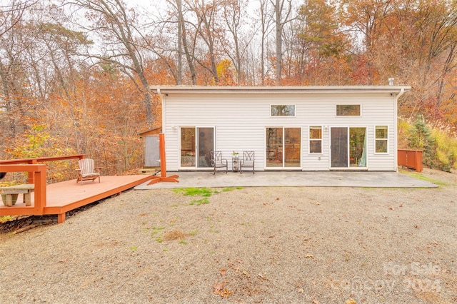 rear view of house with a patio and a deck