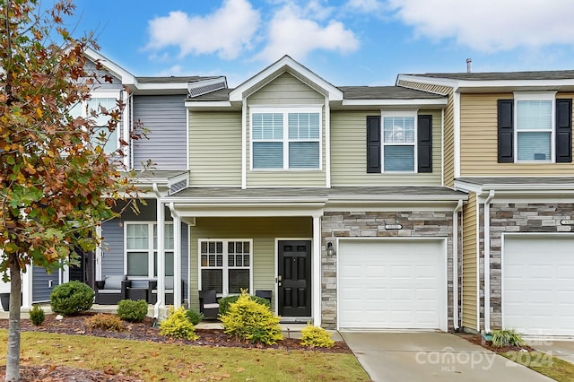 townhome / multi-family property featuring a garage