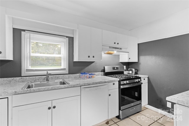 kitchen featuring stainless steel gas range, light tile patterned flooring, sink, white cabinets, and dishwasher