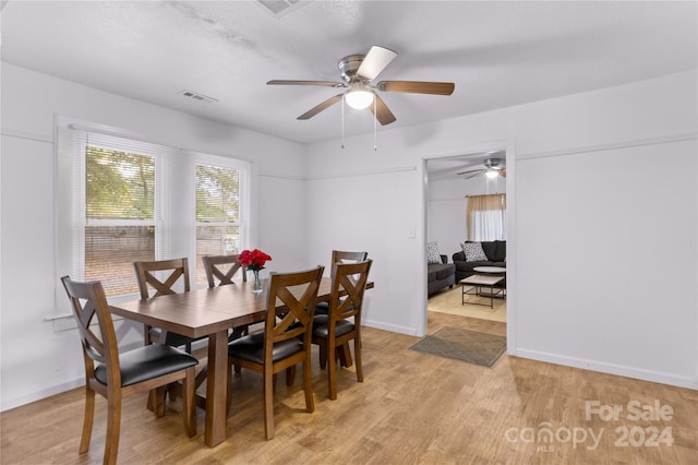 dining room featuring light hardwood / wood-style floors and ceiling fan