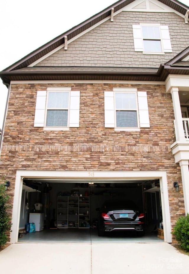 view of side of property featuring a garage