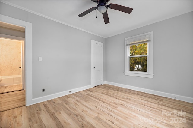 unfurnished room with ceiling fan, light hardwood / wood-style flooring, and ornamental molding