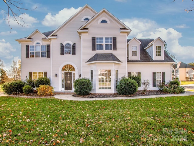 front facade featuring a front lawn