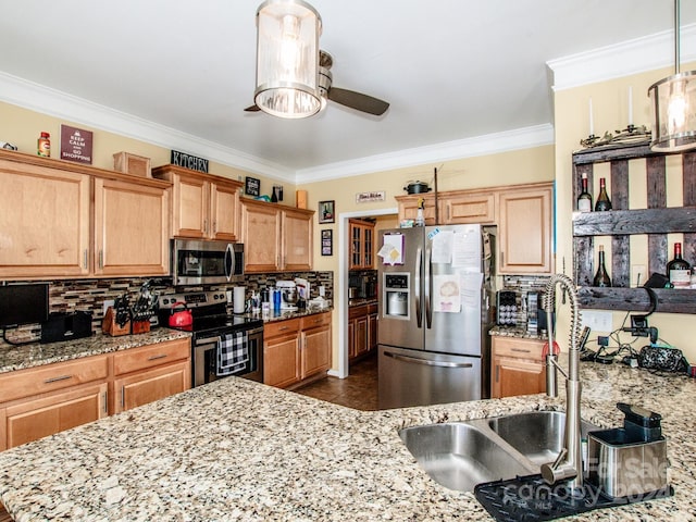 kitchen featuring tasteful backsplash, ornamental molding, hanging light fixtures, and appliances with stainless steel finishes