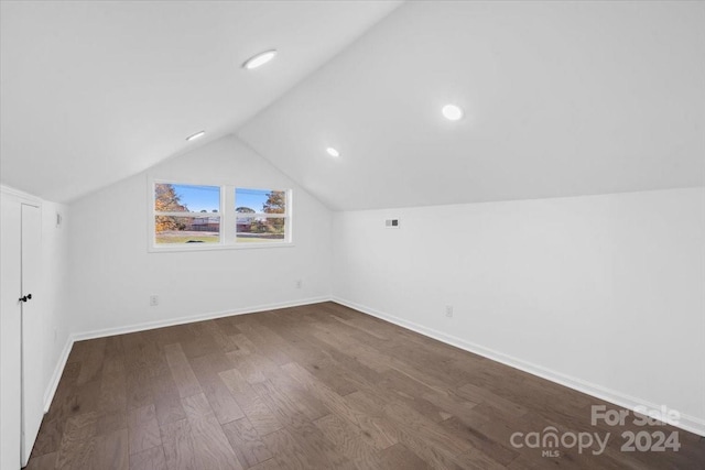 bonus room featuring hardwood / wood-style floors and lofted ceiling