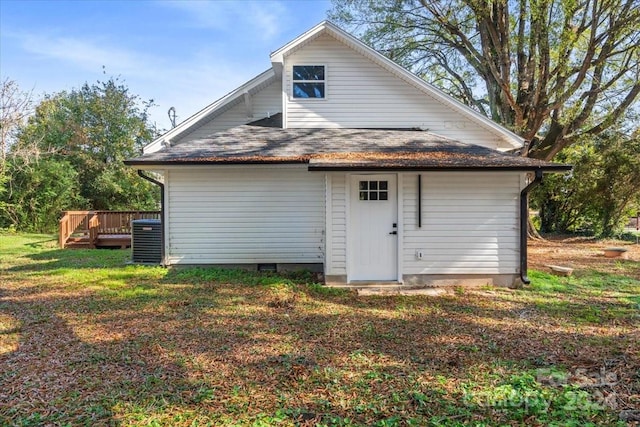 back of property with cooling unit and a deck