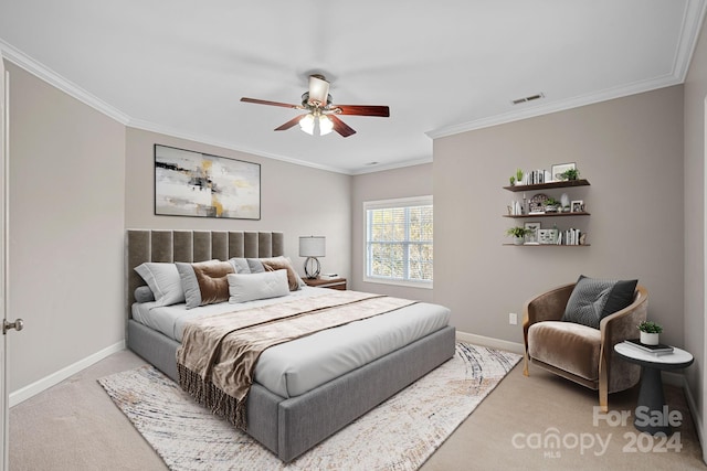 bedroom with ceiling fan, light carpet, and ornamental molding