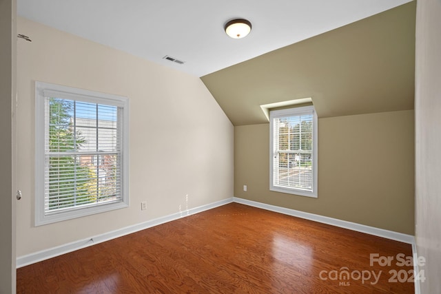 bonus room featuring wood-type flooring and lofted ceiling