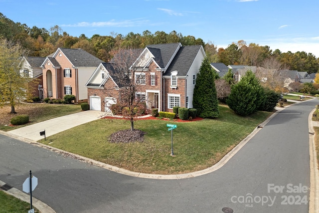 view of front property with a front yard and a garage