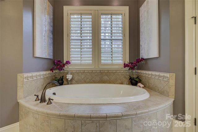 bathroom featuring a relaxing tiled tub