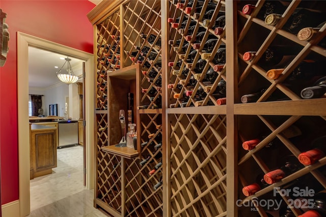 wine cellar featuring ornamental molding