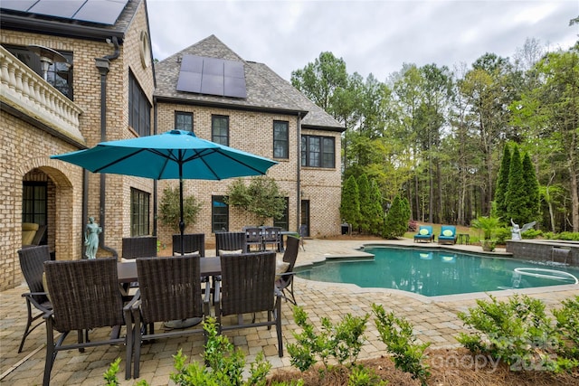 view of pool featuring a patio