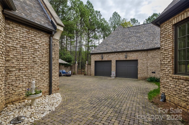 view of property exterior featuring a garage