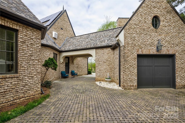 view of patio / terrace featuring a garage