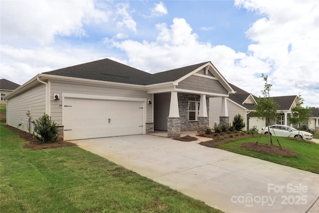 view of front of home featuring a front yard and a garage