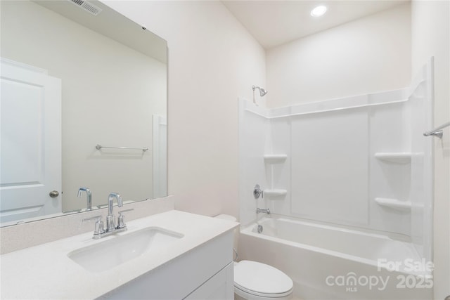 full bathroom with bathing tub / shower combination, vanity, and toilet