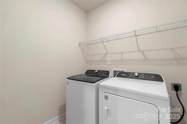 laundry area with separate washer and dryer