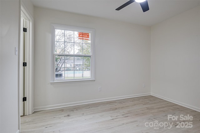 spare room with light hardwood / wood-style floors and ceiling fan