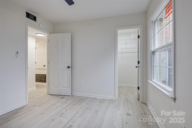 unfurnished room featuring ceiling fan and light hardwood / wood-style floors