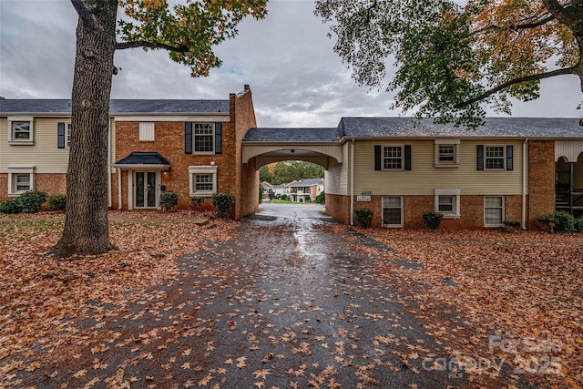 view of front of property featuring a carport