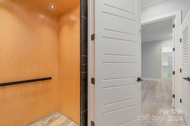 bathroom with hardwood / wood-style flooring