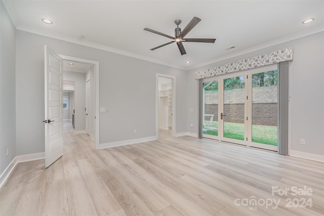 interior space featuring ceiling fan, light wood-type flooring, a spacious closet, and a closet