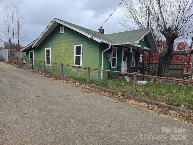 view of property exterior with a porch