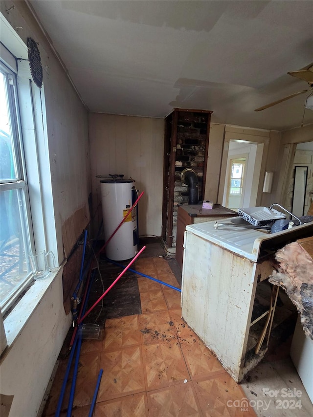 kitchen with water heater and plenty of natural light