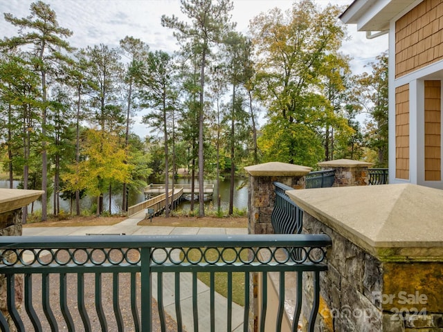 balcony featuring a water view