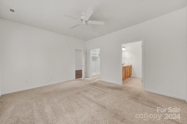 empty room with light carpet and ceiling fan