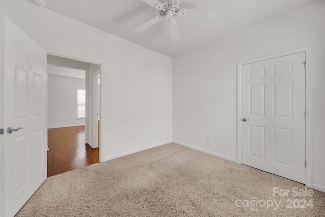 empty room featuring hardwood / wood-style floors and ceiling fan