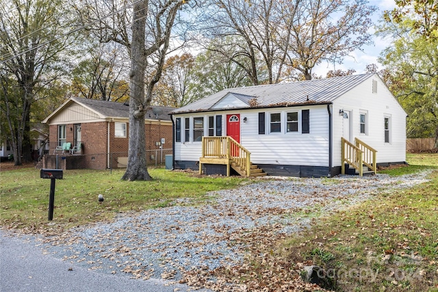 ranch-style house with a front yard