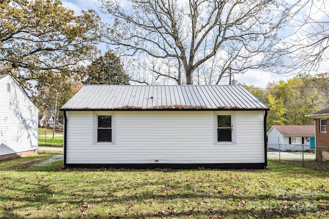 view of property exterior with a lawn