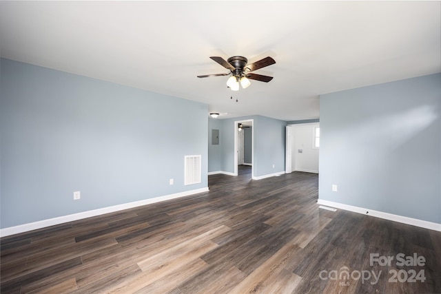 empty room featuring ceiling fan and dark hardwood / wood-style floors