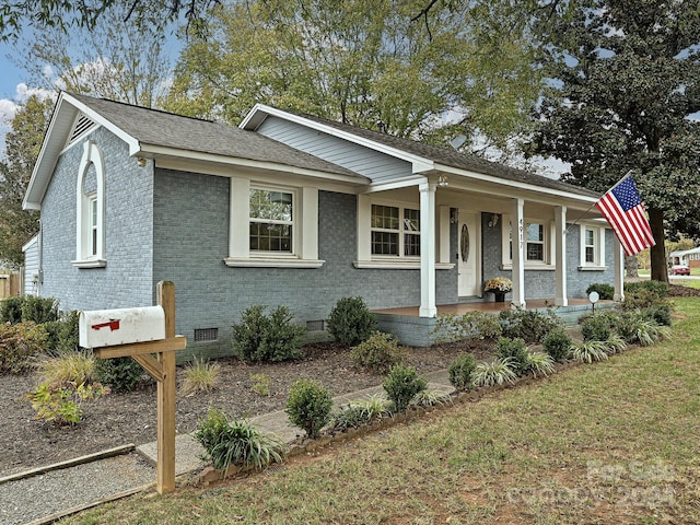 ranch-style house with covered porch