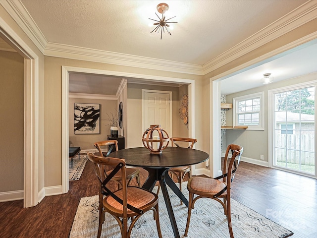 dining space featuring a textured ceiling, dark hardwood / wood-style floors, and ornamental molding