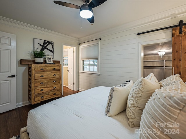 bedroom with ceiling fan, dark hardwood / wood-style floors, a spacious closet, ornamental molding, and a closet