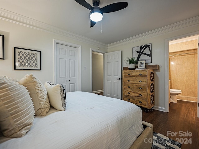 bedroom featuring ensuite bath, ornamental molding, ceiling fan, dark wood-type flooring, and a closet