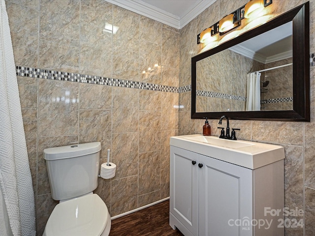 bathroom with toilet, ornamental molding, tile walls, and hardwood / wood-style flooring