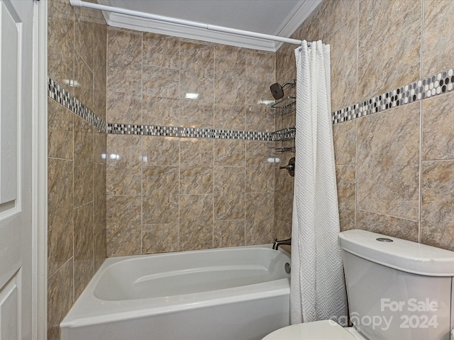 bathroom featuring crown molding, shower / tub combo with curtain, and toilet