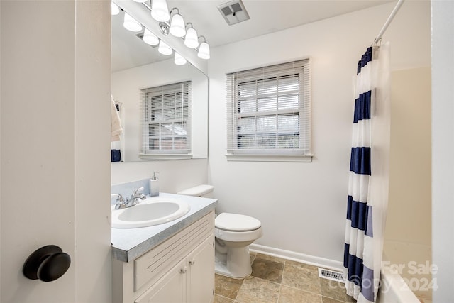 full bathroom with toilet, shower / tub combo with curtain, and vanity