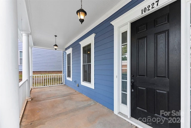 property entrance with a porch