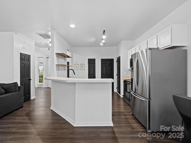 kitchen with stainless steel appliances, white cabinets, sink, and dark wood-type flooring